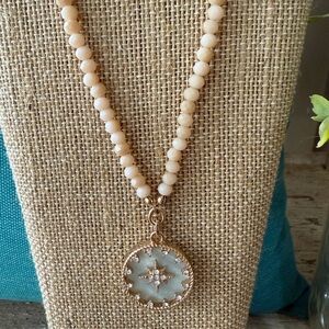 Elegant Gold and Cream Pendant Necklace